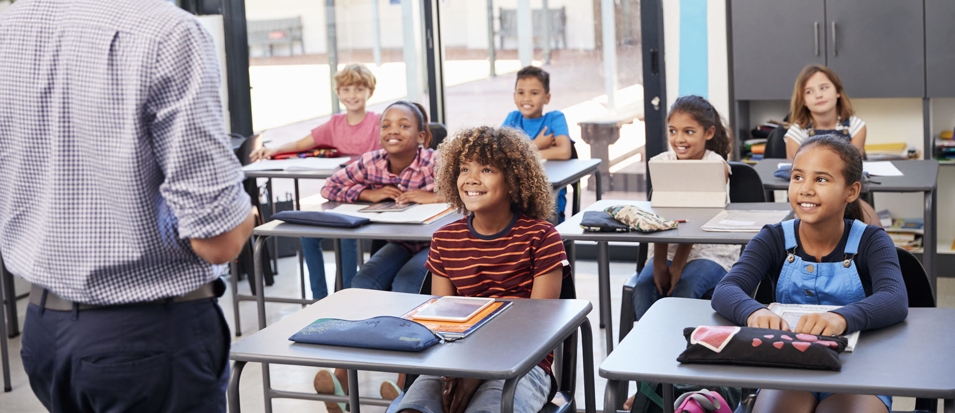 A grade school student looks bored while sitting in class